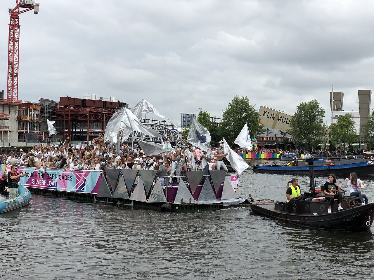 A Pride Canal Parade boat moving through Amsterdam.